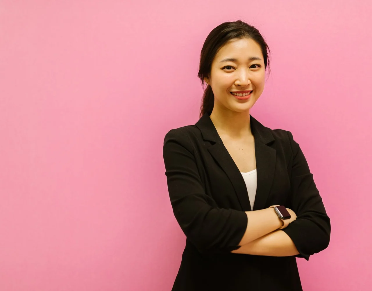 A person smiling, looking to the side