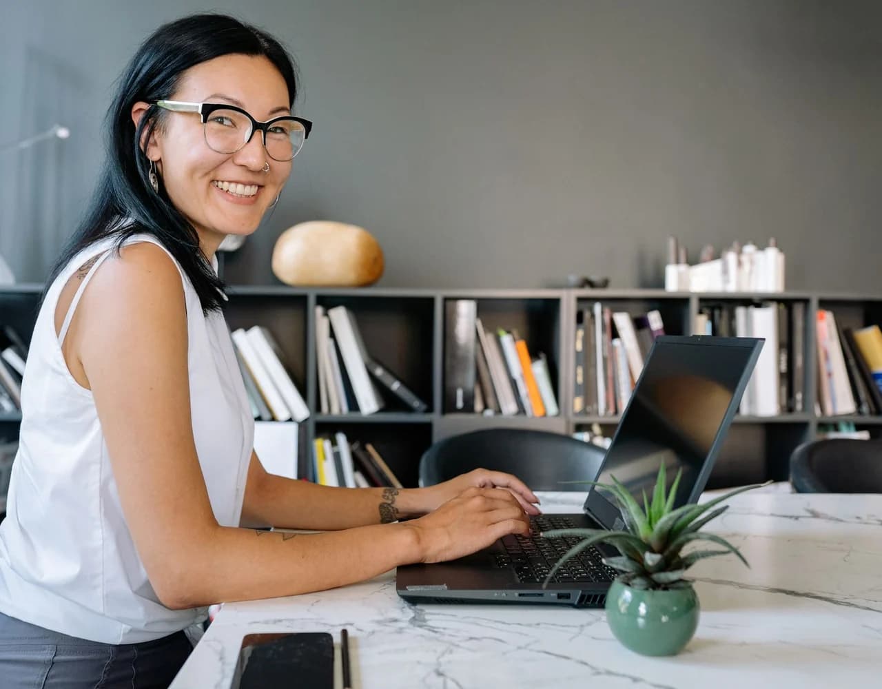 A person using a laptop at home