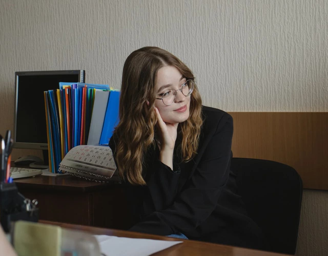 A person reading on a laptop