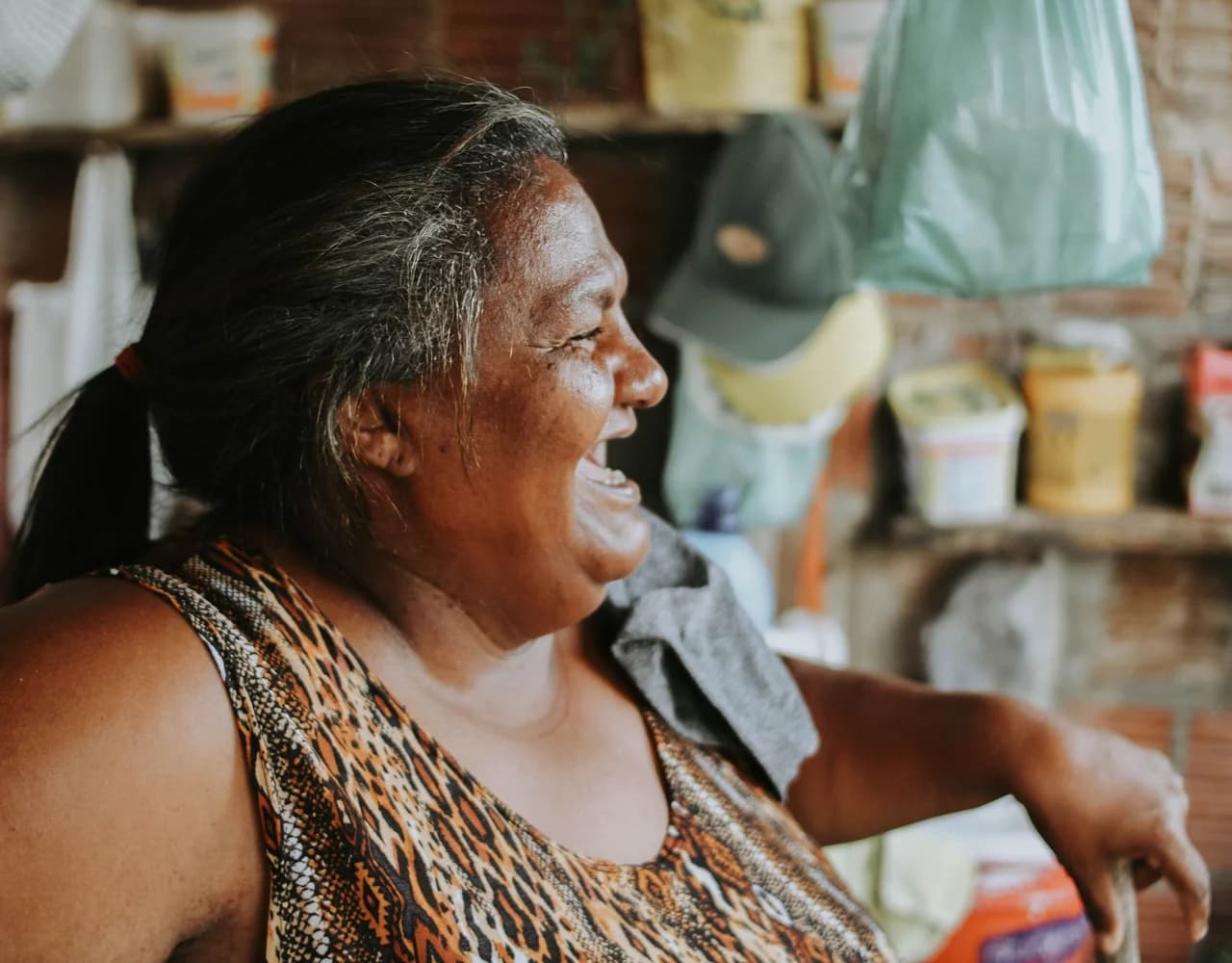 A person sitting comfortably, smiling